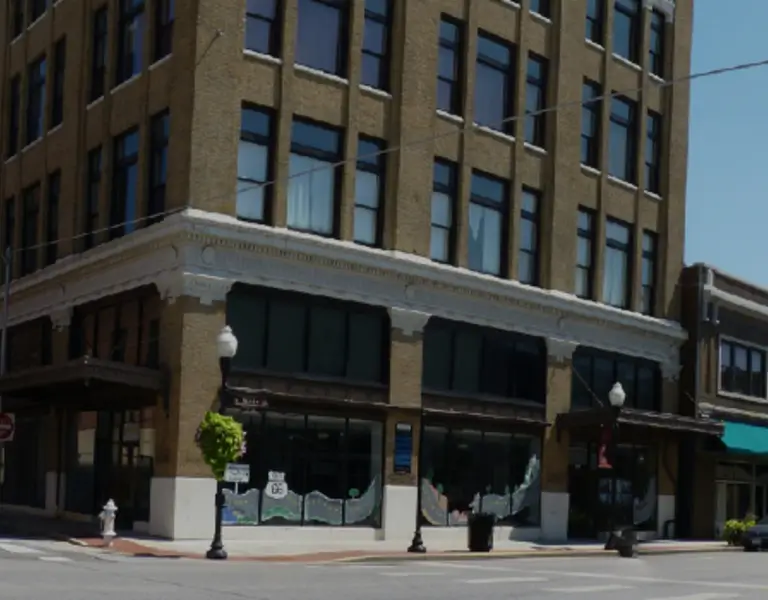 a street with a traffic light and cars on it