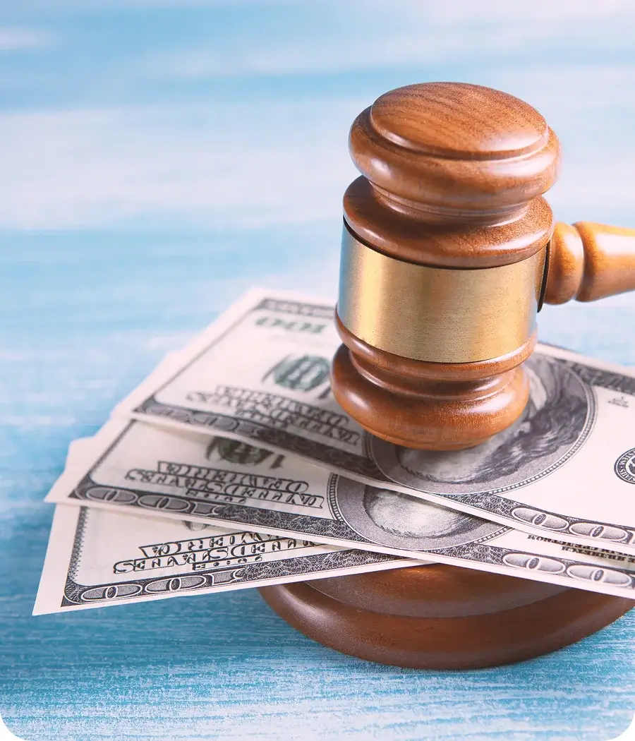 Court gavel and money at the bottom